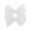 Dettaglio ravvicinato di fermagli per capelli a fiocco in tessuto bianco con trama a righe - Stile Texture Bianca