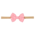 Detail of pink grosgrain ribbon bow on a soft nude nylon stretchy headband - Pink