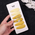 Detailed macro view of 6pcs yellow floral fabric BB hair clips on a white display card - Yellow and Ginger Floral (2757-4)