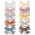 Flat lay of 10 lace bow hair clips set for kids in various colors and fine embroidery - 10 Colors Mixed Set (10 Items)