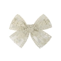 Detailed macro view of the intricate floral lace embroidery and soft beige fabric texture - Bean Green