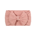 Pink cable knit baby headband with elastic fabric and a large matching bow decoration - Pink