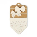 Close-up of floral baby headband and bib set on display card with pink flower patterns - Cream Pink Floral Style (2)