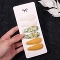 Detail view of 6-piece floral fabric snap clips in green and yellow on a white display card - Cream Lace Green Floral (2757-9)