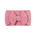 Pink knit baby headband featuring elastic jacquard texture and a large soft bow - Pink