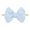 Detailed view of baby headband featuring a light blue bow on a soft elastic nylon band - Light Blue