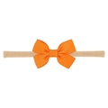 Close-up of vibrant orange grosgrain ribbon bow on a soft nude nylon baby headband - Bright Orange