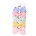 Vue détaillée de cinq barrettes à nœuds aux couleurs pastel avec motif d'étoiles - Style Tissu à Étoiles (10)