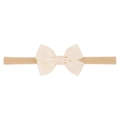 Close-up of handmade cream grosgrain ribbon bow with soft elastic nylon baby headband - Off White