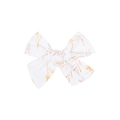 Detail of handmade cotton hair clip showing white fabric texture and yellow leaf pattern - White Light Yellow Botanical Print