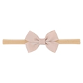 Infant nylon headband featuring a champagne-colored grosgrain ribbon bow in soft fabric - Champagne
