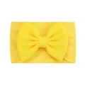 Detailed shot of yellow baby headband with large waffle texture fabric bow and elastic nylon - Yellow (32)