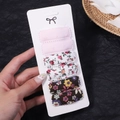 Set of six floral and solid fabric BB clips on display card held by hand - Pink Floral Brown Floral Style (2756-11)