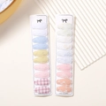 Close-up of fabric-wrapped BB hair clips with floral embroidery and macaron patterns - 20Pcs Set / 20D