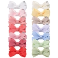 Macro detail of grosgrain ribbon texture and color options for kids bow hair clips - Multicolor