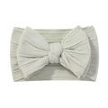 Detailed texture of mint green ribbed nylon baby headband with a soft elastic bow - Mint Green