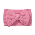 Pink stretchy nylon baby headband with a large textured knit bow on a white background - Candy Pink