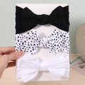 Dettaglio del set da 3 fasce per neonati in nylon con grandi fiocchi neri, bianchi e a pois - Nero Pois Bianco Puro (3)