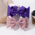 Detail view of purple ribbed and pink waffle textured baby bow headbands on display card - Purple And Dusty Pink (5)