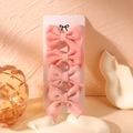 Close-up of four pink fabric bow hair clips with textured patterns on a display card - Light Peach Pink Fabric And Woolen Style (7)