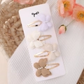 Detail view of handmade lace butterfly clips with pearls on elegant display card - Lavender White Beige Coffee Combination (2)