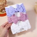Lot de trois bandeaux élastiques pour bébé avec grands nœuds en violet, rose et blanc - Tricot Élégant Lot de 3 (Sans Carton)