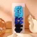 6-piece set of blue fabric hair clips featuring bows and flowers on a display card - Blue Series Style (6N)