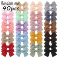 Set of 40 handmade waffle fabric bow hair clips for girls in various pastel colors - 40b