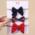 Detailliertes Set aus drei Baby-Schleifen-Stirnbändern in Marine, Floral und Rot - 3C-Zertifizierung
