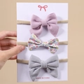 Dreiteiliges Baby-Stirnband-Set mit lila Filz, floraler Baumwolle und grauem Kordbogen - 3.00g