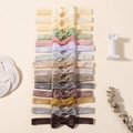 Gedetailleerde set van 15 kleurrijke elastische baby-haarbanden met grosgrain strikken - 15 Stuks (15B)