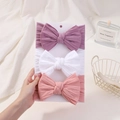 Detailed view of elastic nylon baby headbands with large bows in pink, white and purple - Light Purple/White/Light Pink (3C)