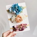 Three-piece baby nylon headband set with blue silk flowers and pastel rose designs - 3D Detail