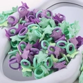 Vue détaillée d'élastiques à cheveux colorés avec étoiles en lavande et vert menthe - Lot de 30 / Multicolore (30B)