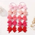 Detail view of 10pcs children's gradient pink bow hair ties set on a white background - Style 10F