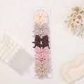 Detailed set of 10 ribbon bow hair clips in earthy tones on a white display card - Earth Tone Pink Mix (10C)