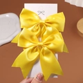 Paire de barrettes à nœuds en satin jaune vif pour filles sur carte de présentation - 2 Pièces/Ensemble / Jaune vif