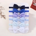 Set of six baby bow headbands in shades of blue and white on a display card - 6J Style / Set of 6