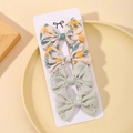 Set di fermagli per capelli con fiocco floreale giallo e fiocco verde chiaro traforato - Set 4 Pezzi Floreale Traforato (4C)