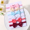 Set of 6 colorful nylon baby headbands with grosgrain ribbon bows on a display card - Style 6V / Set of 6