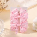 Pair of pink daisy print grosgrain bow hair clips displayed on a white product card - Pink Daisy (FJ039-2A-13)