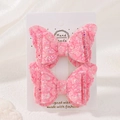 Detail of pink lace and sequin butterfly hair clips on a white brand card - Pink