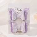 Close-up of handmade purple lace butterfly hair clips with glitter sequins for girls - Purple