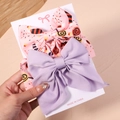 Detalle de lazos para el pelo grandes con estampado de dulces y satén lila en pack - Caramelo Rosa y Satén Púrpura
