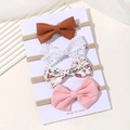 Set of 4 baby bow headbands featuring brown leather, lace, floral, and pink fabric styles - Leather And Floral Pink Combination Style (4E)