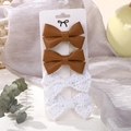 Set van 4 haarspelden met bruine kunstleren strikken en delicate witte kanten strikken - Leder Kant Stijl (4F)