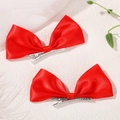 Pair of bright red satin bow hair clips for girls featuring silver metal duckbill clips - 2A-12 / Red