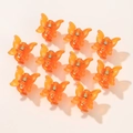 Set aus 10 Mini-Schmetterlings-Haarklammern in Orange mit mattem Finish auf Rosa - Durchscheinendes Orange (10A-15)