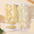 Set di 8 fiocchi per capelli giallo crema per bambini con nastri in gros-grain su cartoncino - 8C