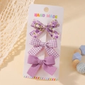 Set di tre fiocchi per capelli viola con motivi floreali e a quadretti su carta - Serie Viola Set